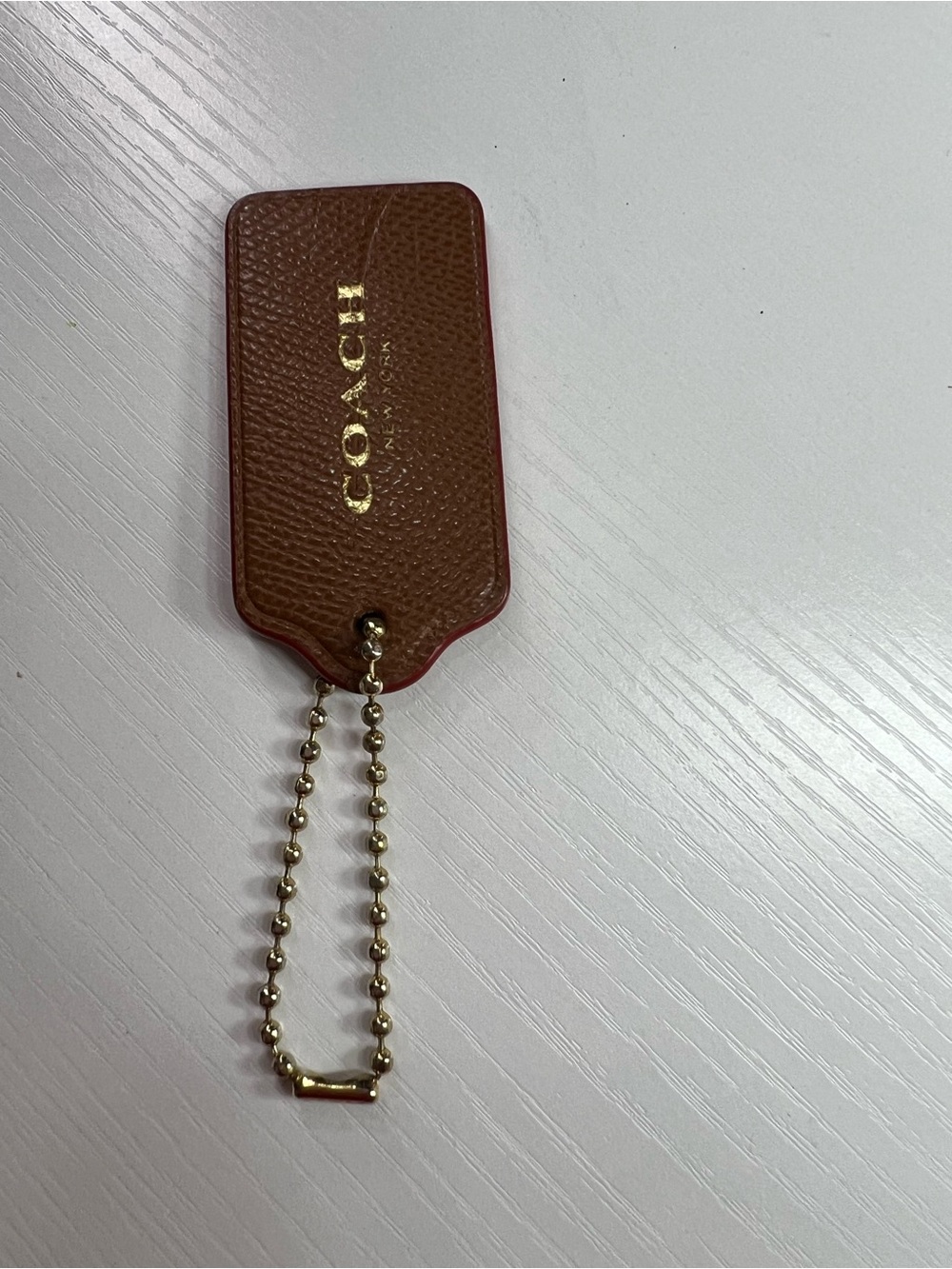 COACH Brown Leather Res Trim Tag